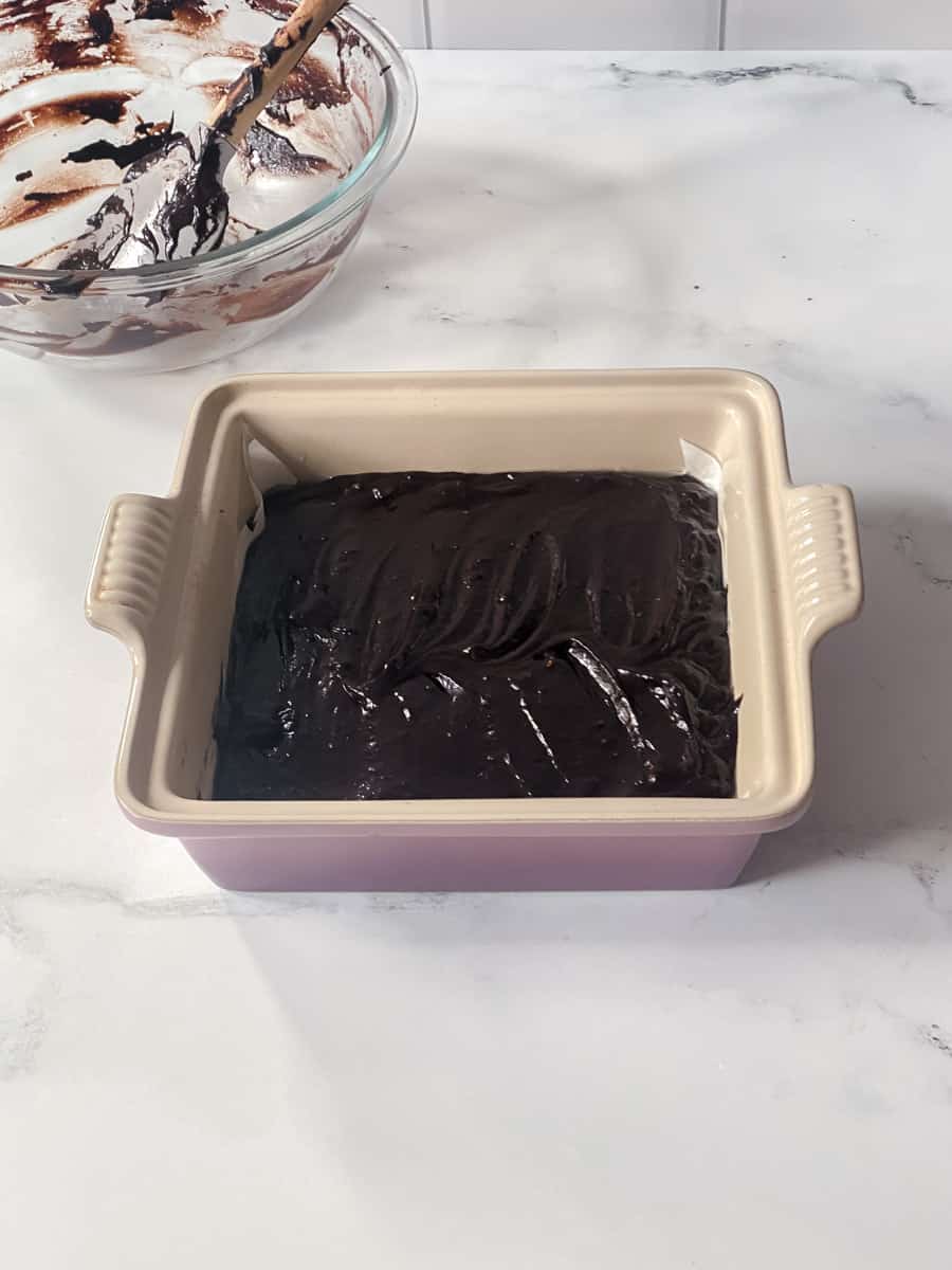 Brownie batter in pan before being baked. 