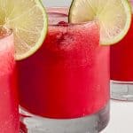 close up of drink with lime on the rim.