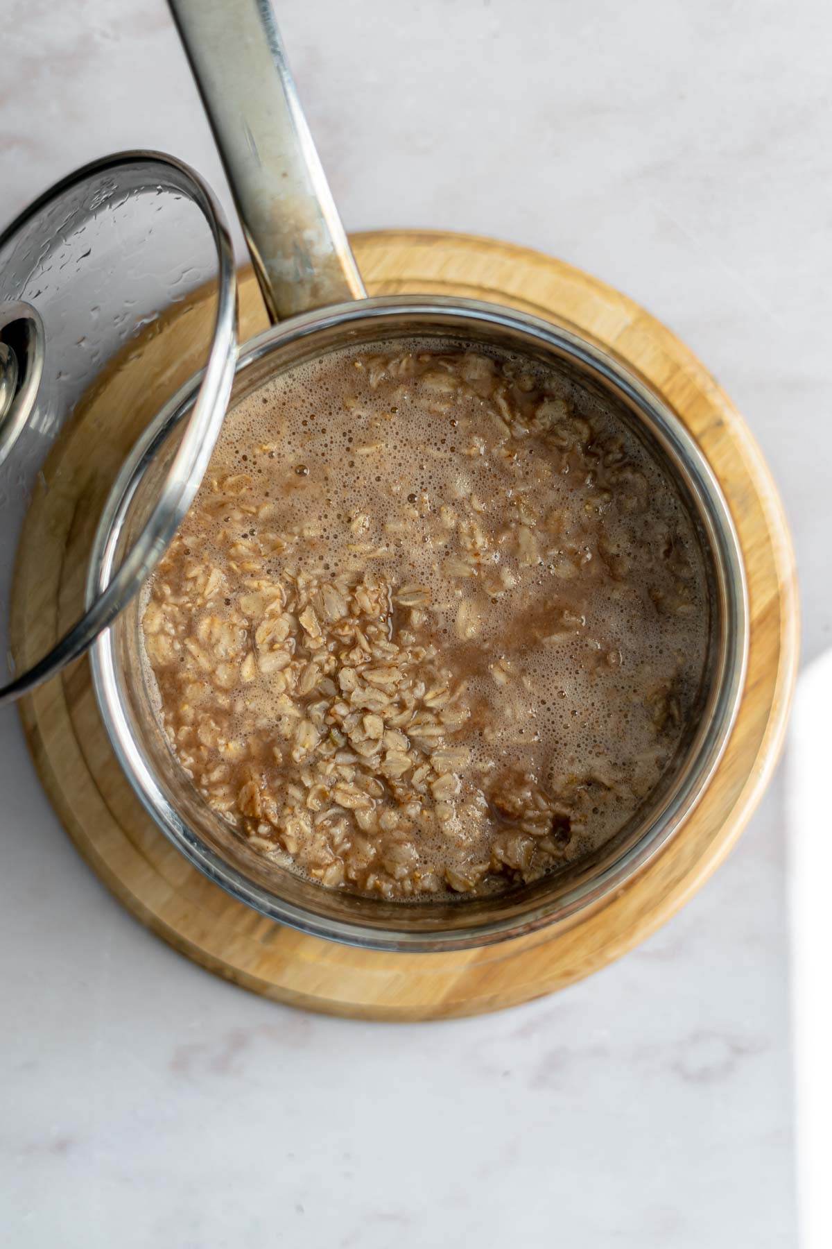 cinnamon spice oats in pot half cooked.