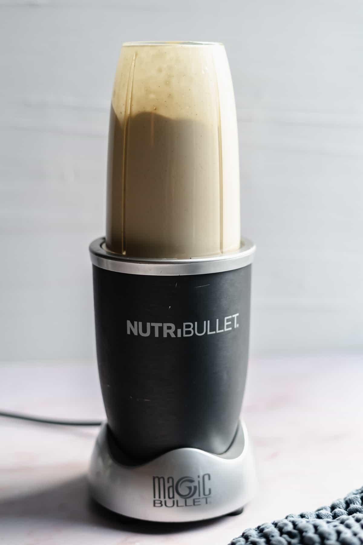 dairy free cheese sauce being blended in magic bullet cup.